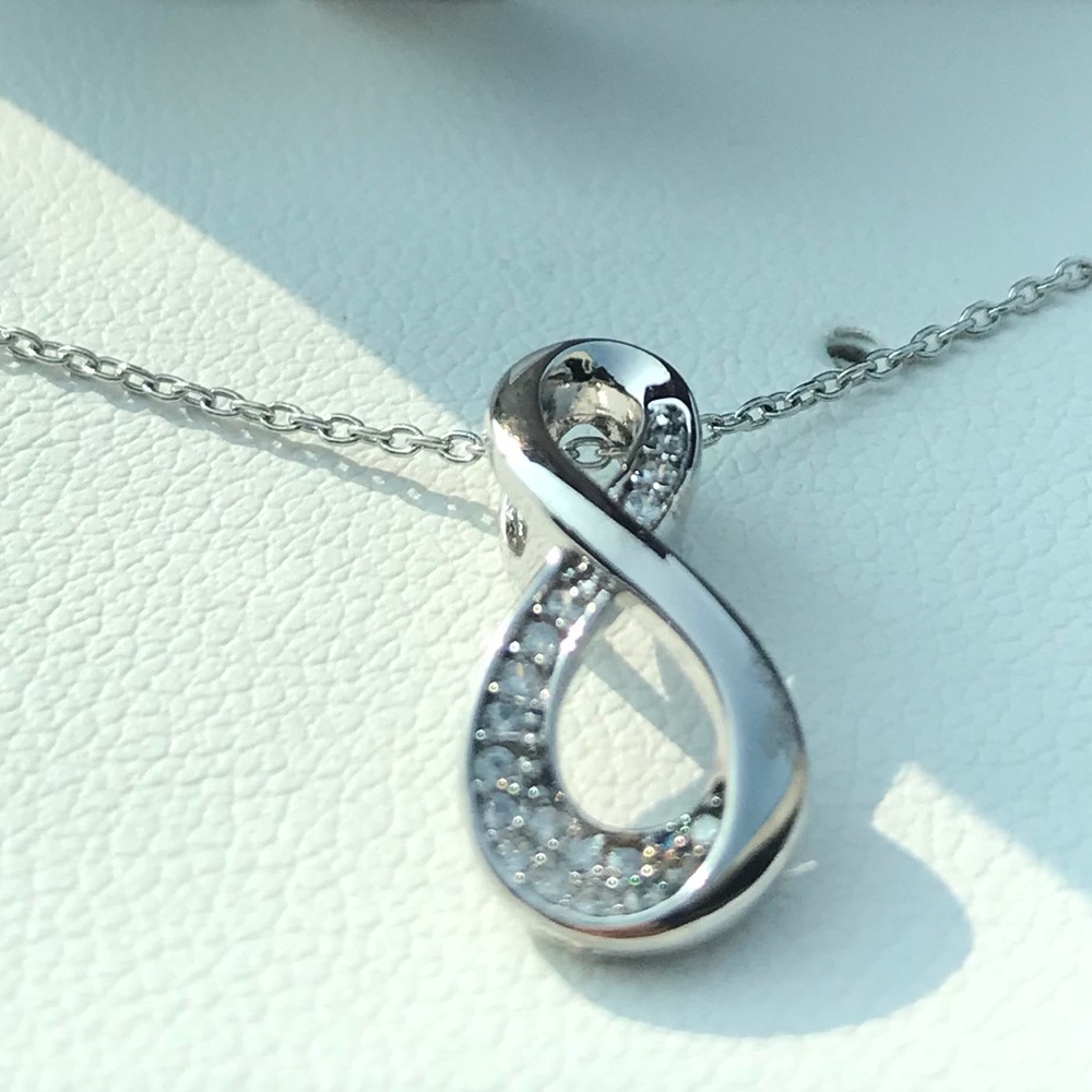 Sterling silver infinity; still in box never removed never wear jewelry anymore